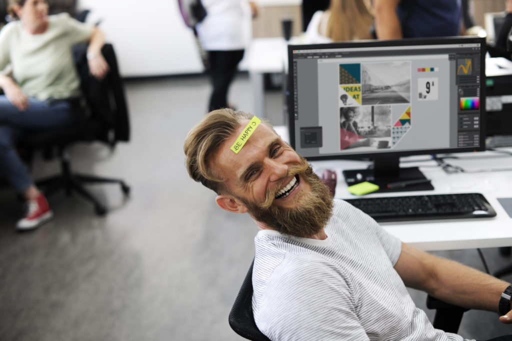 Man Having Be Happy Sticky Note on Forehead During Office Break Time